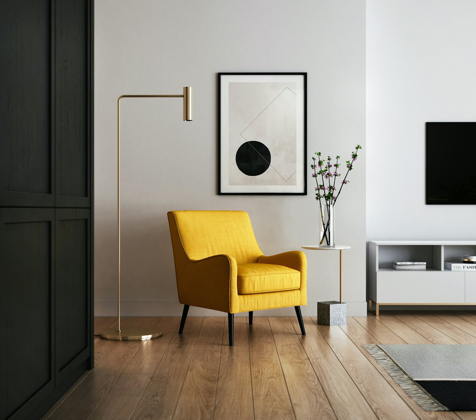 Detalle de salón reformado con butaca y suelo de madera
